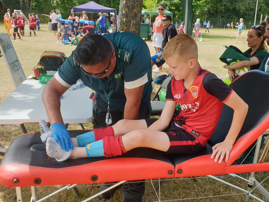 Medic providing event medical cover at outdoor festival